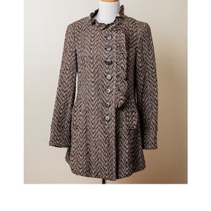 Overlap coat with buttons and ruffle detail.